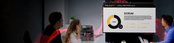 Three people having a meeting looking at a Sharp AV 