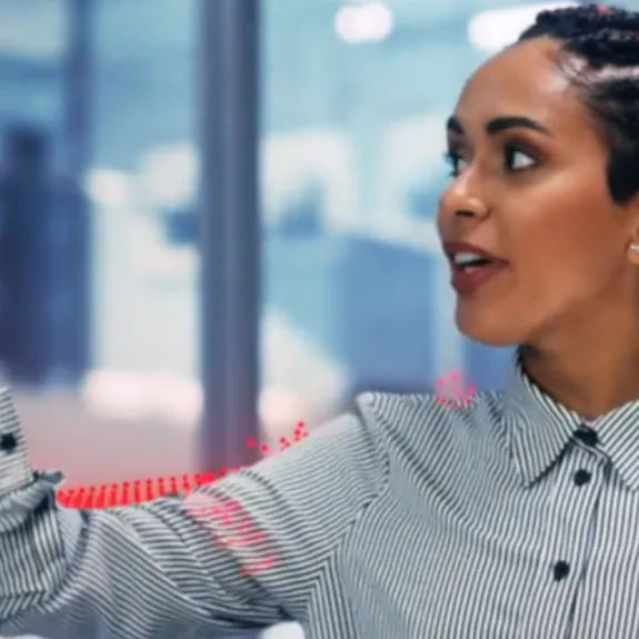 Lady presenting on Sharp display screen