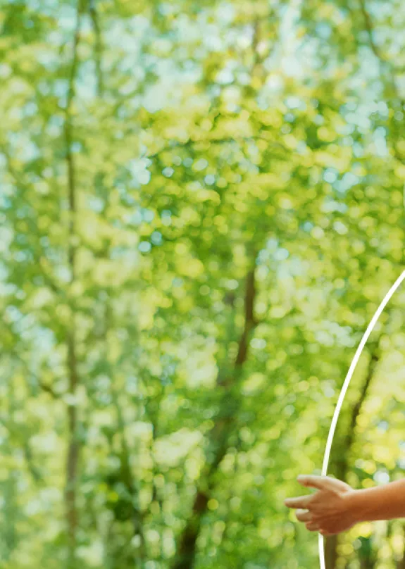 A woman Infront of trees with Sharp product icons